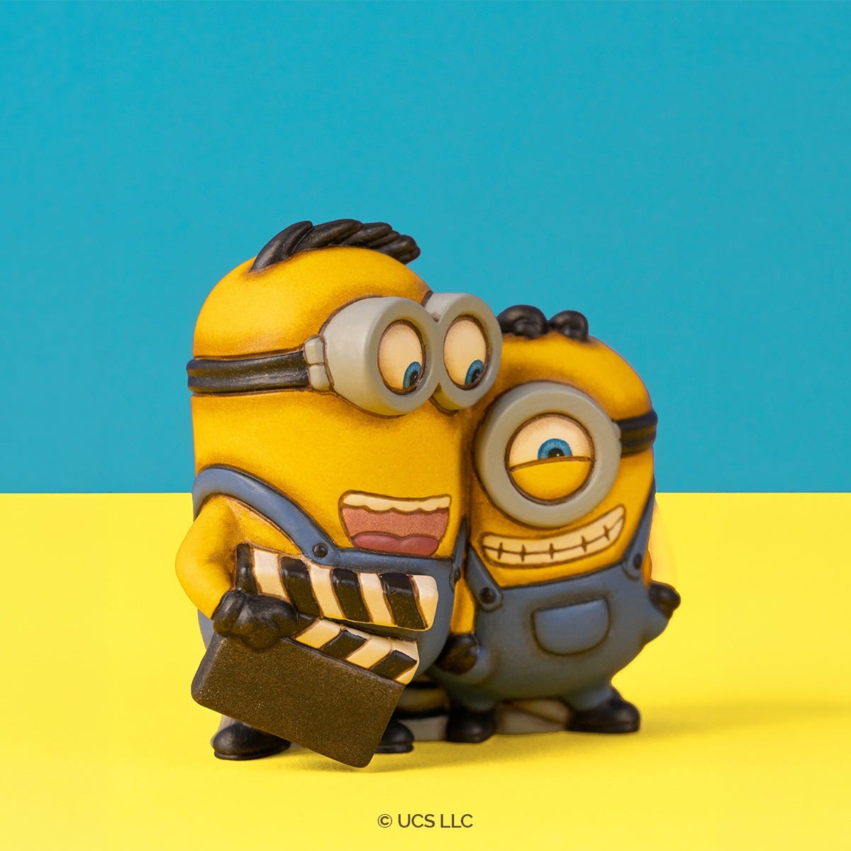 Minions® - Coppia Harry e James con ciak – Thun